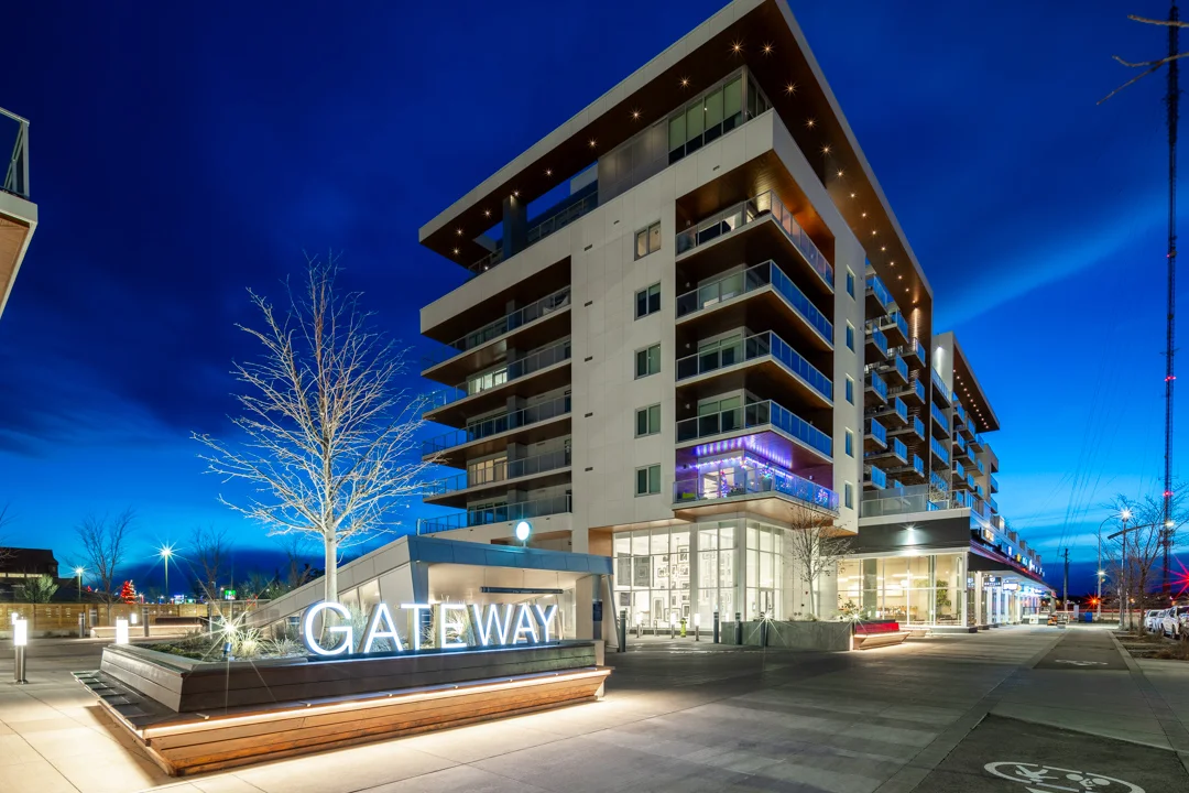 Gateway in West District, West Springs, photographed at twilight