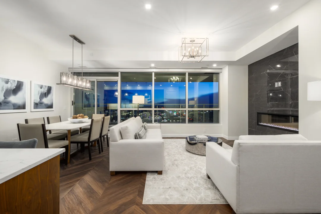 Open living and dining space with large windows in a Gateway penthouse in West District