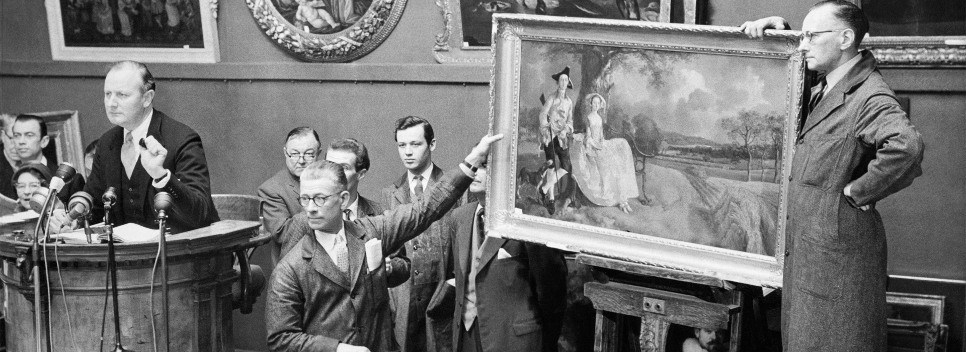 Archival black and white photograph of an auction at Sotheby’s